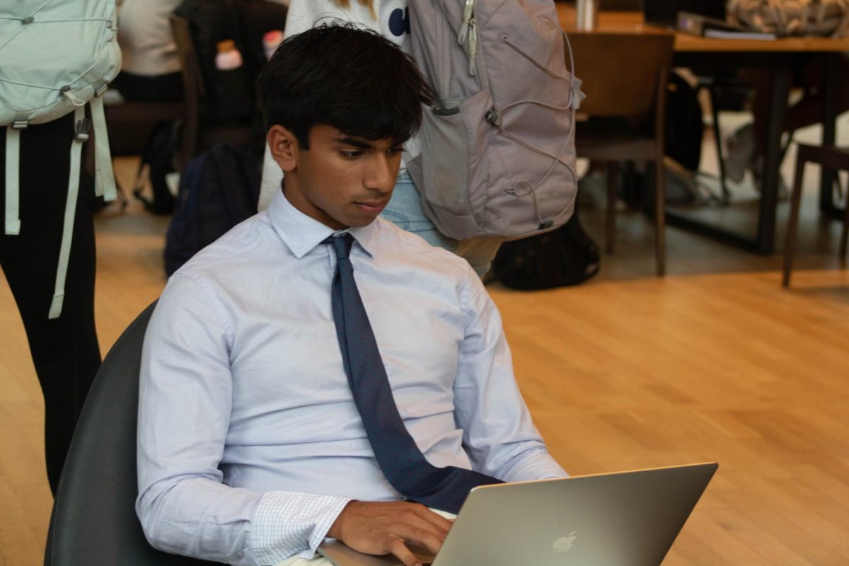 Vedant Kulkarni (Class I) finishing homework before leaving for a soccer game