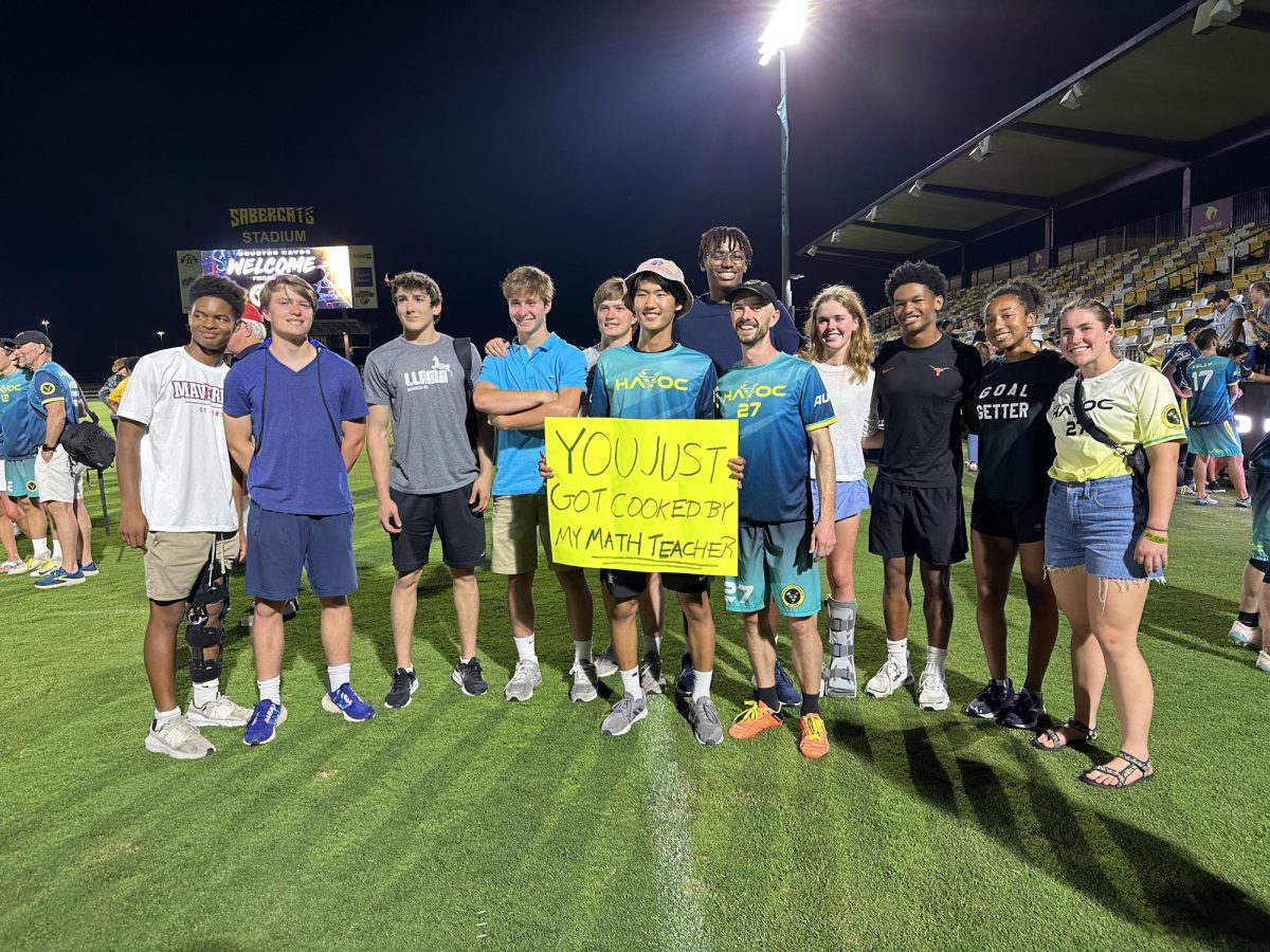Mathematics Faculty Elliot Sakach with his students at his ultimate frisbee game