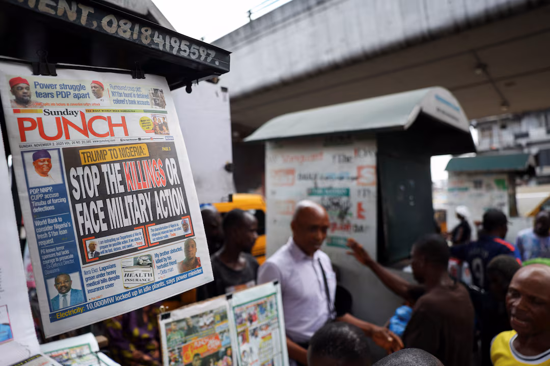A newspaper with an article reporting U.S. President Donald Trump's message to Nigeria over the treatment of Christians hangs at a newspaper stand in Ojuelegba, in Lagos state, Nov. 2, 2025