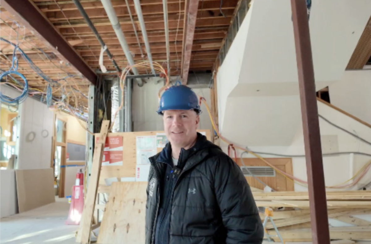 Director of Buildings and Grounds Mike McHugh standing in Gleason Hall during a Shattuck Schoolhouse project walkthrough
