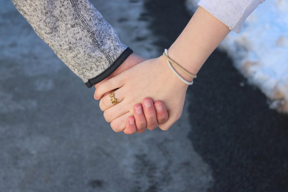 Holding hands on a walk from Edgerley Academic Center
