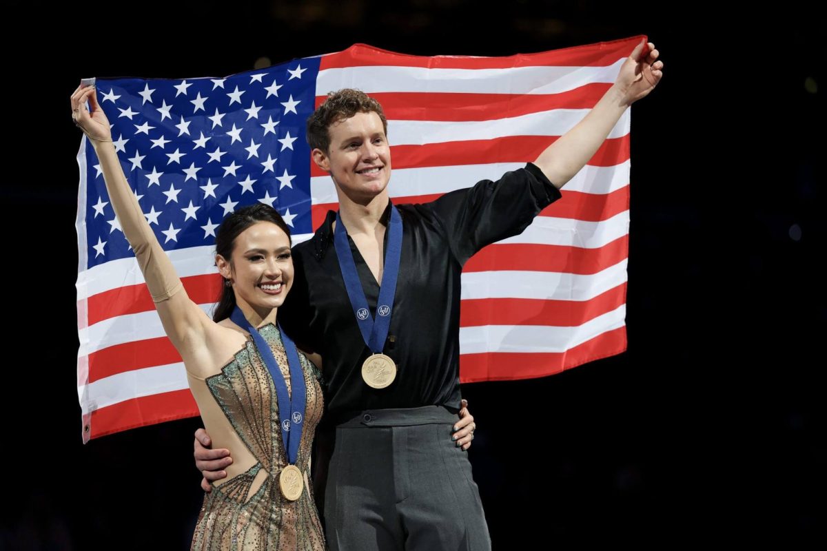 American ice dancers Madison Chock and Evan Bates in TD Garden after capturing their third consecutive world championship gold medal.