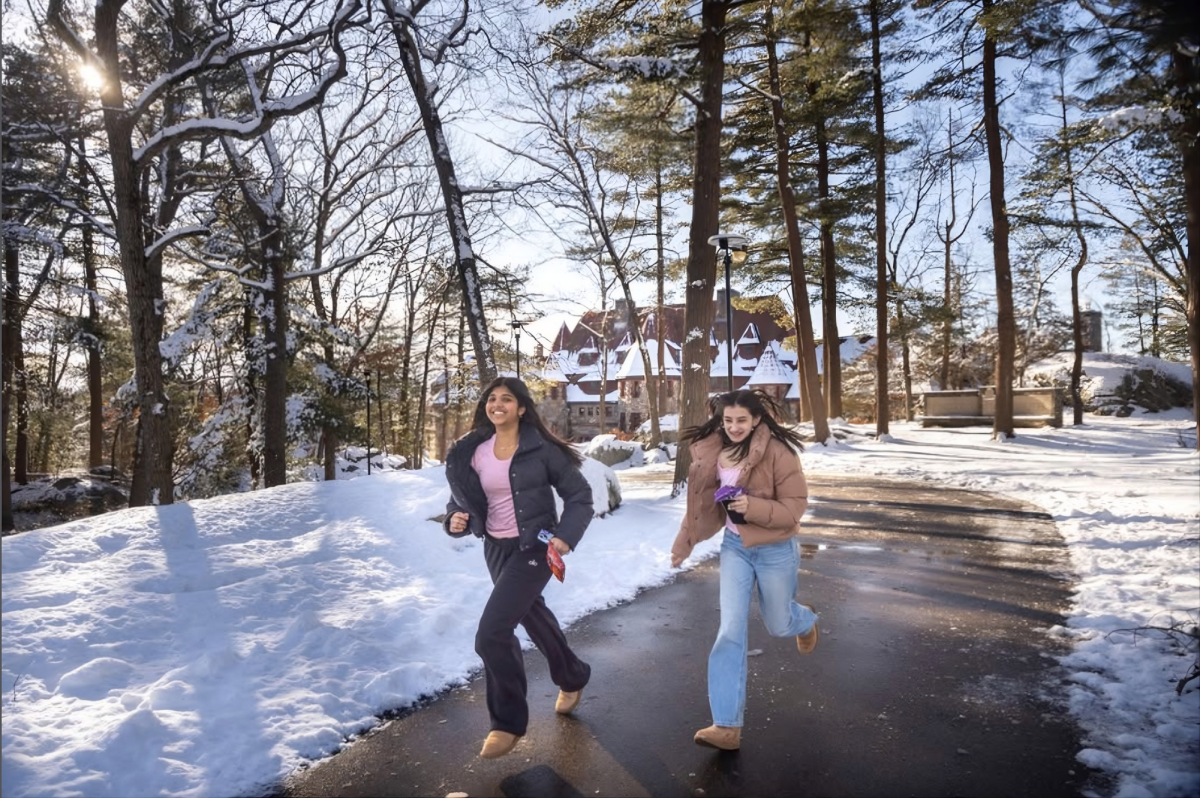 Nila Bharathan (Class IV) and Rania Hasan (Class IV) running from the castle on a chilly winter day