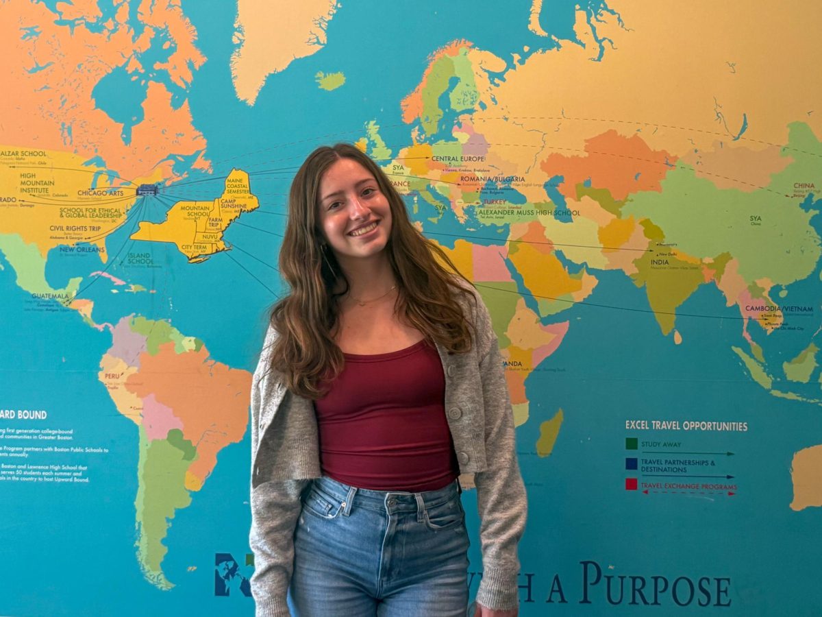 Christina Hall (Class I) pictured in front of the EXCEL map in the Henderson Arts Center