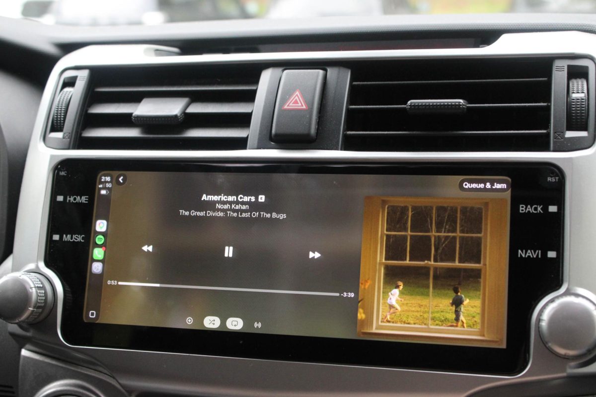 A student listening to the new Noah Kahan album in the car